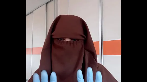 Phim mới Housekeeper trying on hijab in front of a mirror tổng số